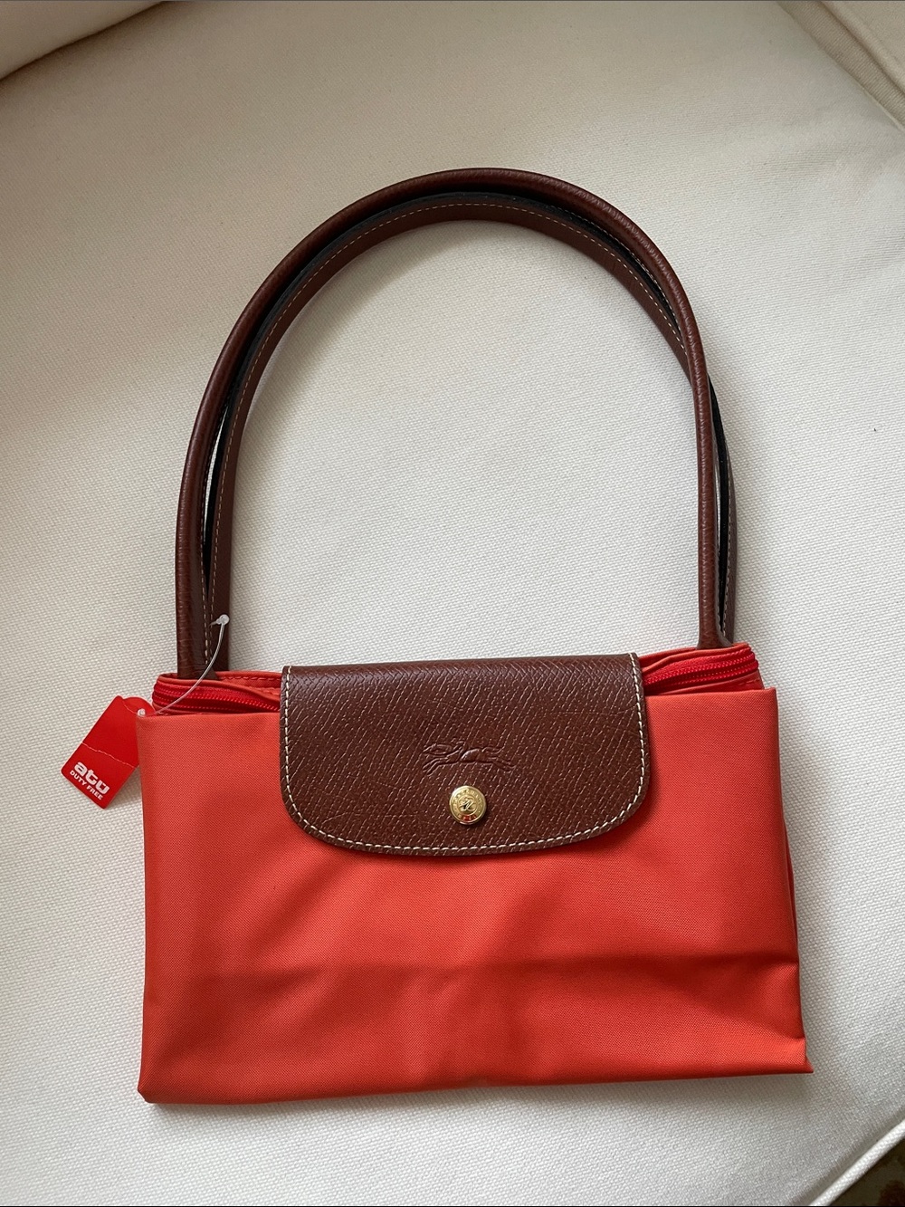 Longchamp Classic orange Women’s Shoulder Bag with Brown leather handles